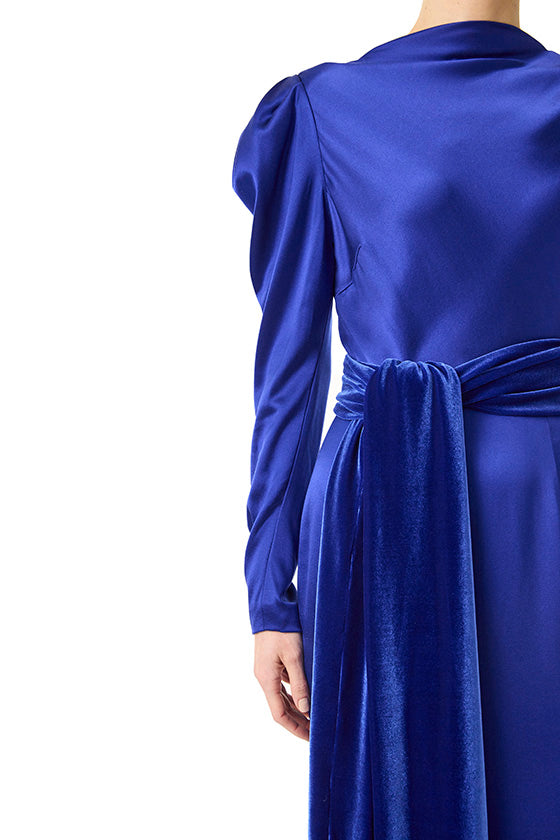 Monique Lhuillier long sleeve royal blue gown with Bateau neckline and velour detached sash.