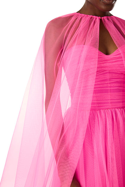 Monique Lhuillier hot pink tulle cape shown over the strapless dress with sweetheart neckline and ruched bodice.