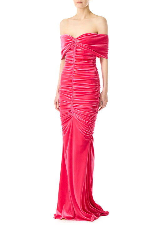 Monique Lhuillier off the shoulder gown with center ruching in fuchsia velour fabric.
