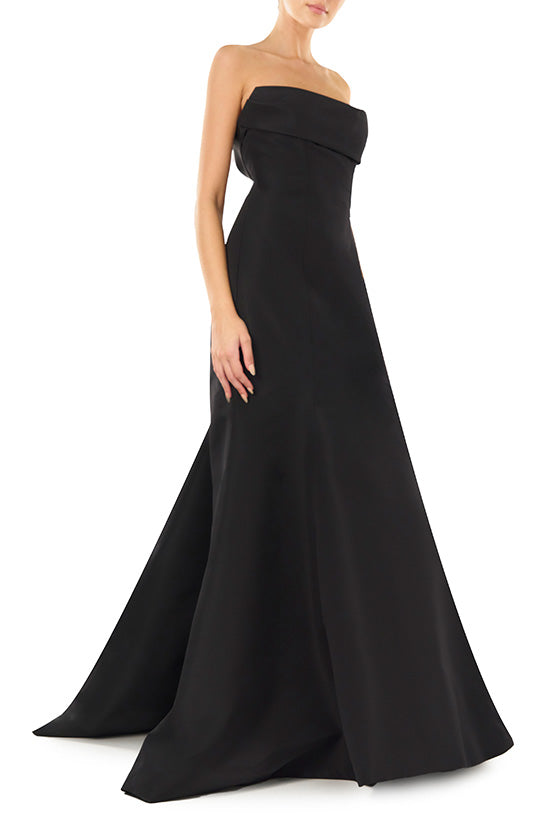 Monique Lhuillier noir strapless, faille evening gown with draped bodice and mermaid skirt.