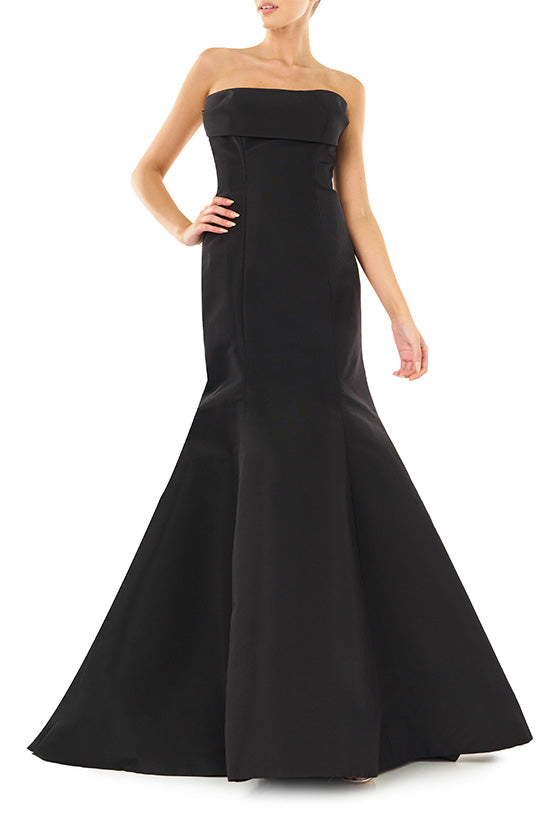 Monique Lhuillier noir strapless, faille evening gown with draped bodice and mermaid skirt.