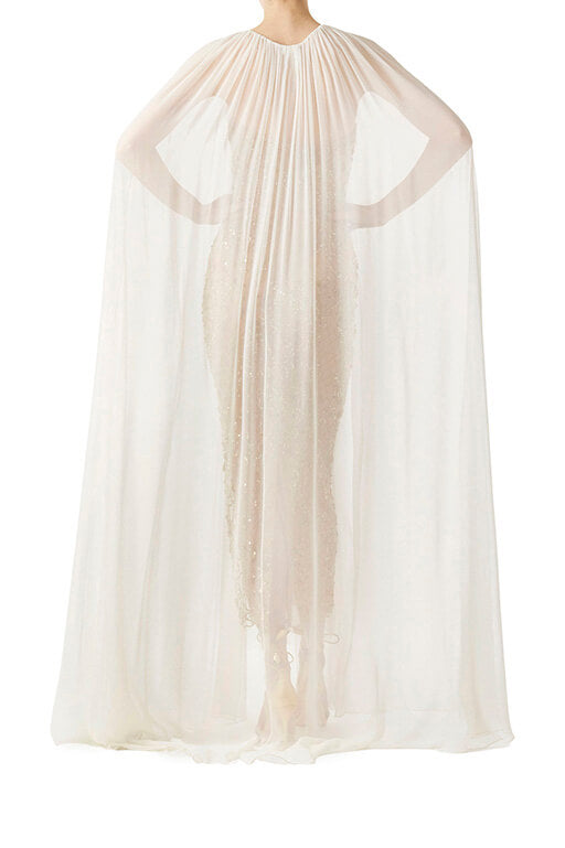 Monique Lhuillier gold embroidered column gown with silk white chiffon cape.