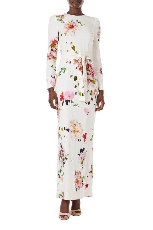 Monique Lhuillier jewel neck, tea-length gown with long sleeves and self-tie sash in silk white floral fabric.