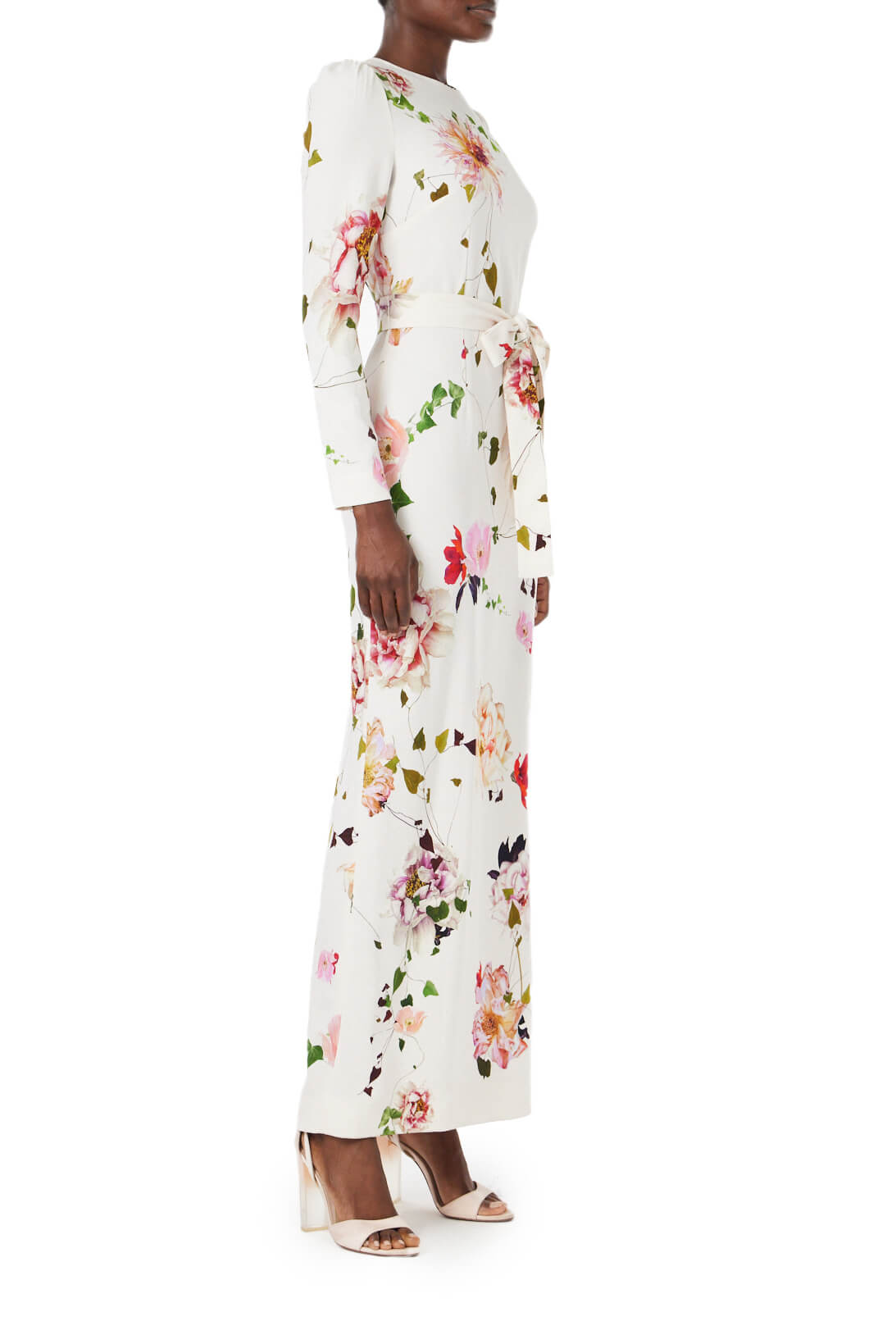 Monique Lhuillier jewel neck, tea-length gown with long sleeves and self-tie sash in silk white floral fabric.