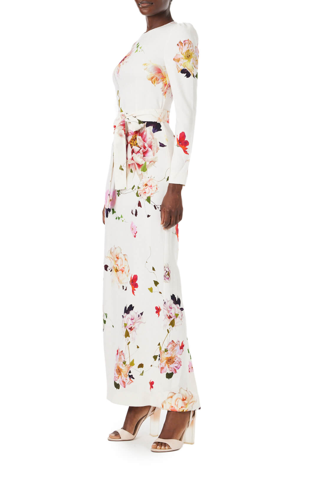 Monique Lhuillier jewel neck, tea-length gown with long sleeves and self-tie sash in silk white floral fabric.