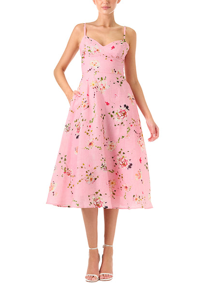 Monique Lhuillier Spring 2024 pink floral print linen cocktail dress with sweetheart neckline, flared skirt and pockets - front.