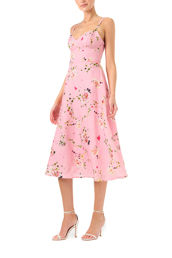 Monique Lhuillier Spring 2024 pink floral print linen cocktail dress with sweetheart neckline, flared skirt and pockets - left side.