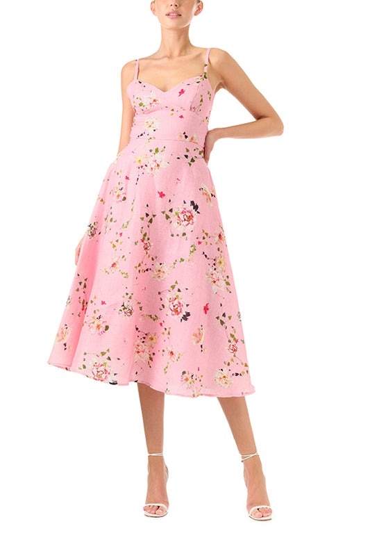 Monique Lhuillier Spring 2024 pink floral print linen cocktail dress with sweetheart neckline, flared skirt and pockets - front.