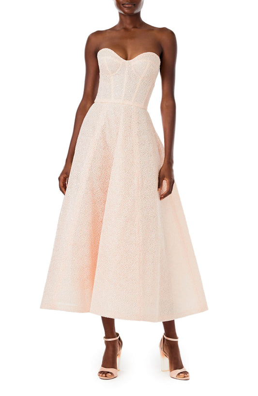 Monique Lhuillier // Spring 2023: Marisa mini. Darling. Can be strapless.  Gloves have entered the playing field 🤍 #boldandbridalstyle