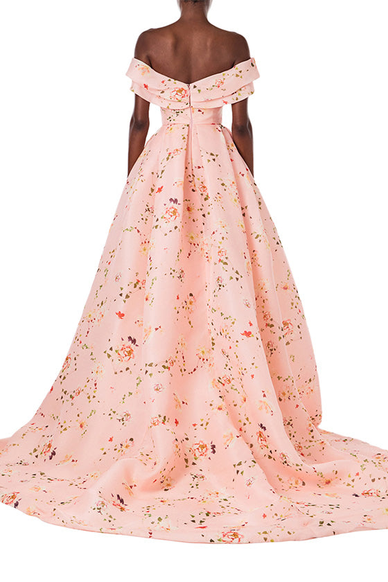 Monique Lhuillier peony floral floor length gown with off the shoulder neckline, high leg slit and draped bodice.