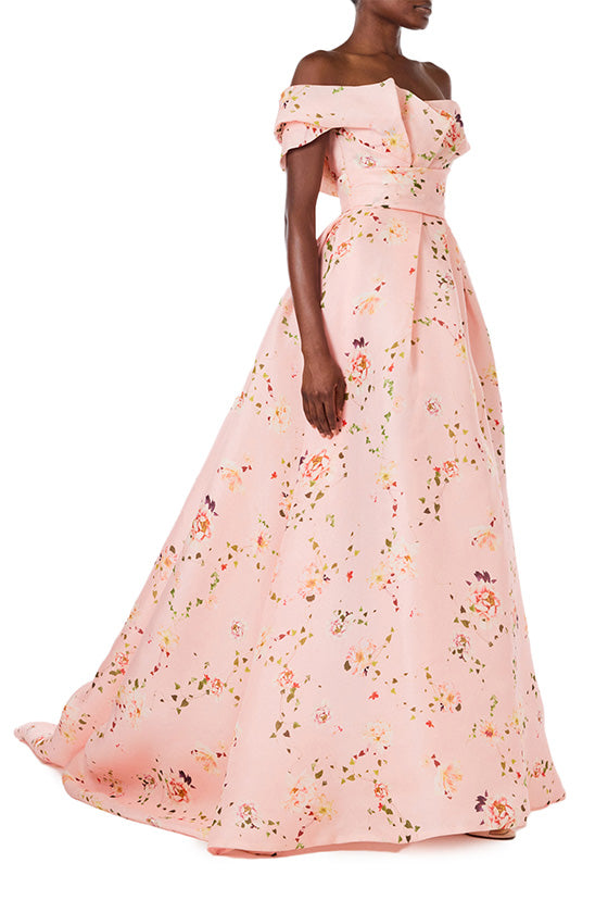 Monique Lhuillier peony floral floor length gown with off the shoulder neckline, high leg slit and draped bodice.