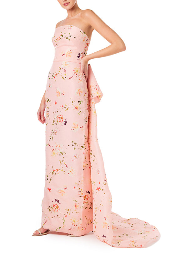 Monique Lhuillier strapless column gown in pink peony flora gazar fabric with tufted bustle train.