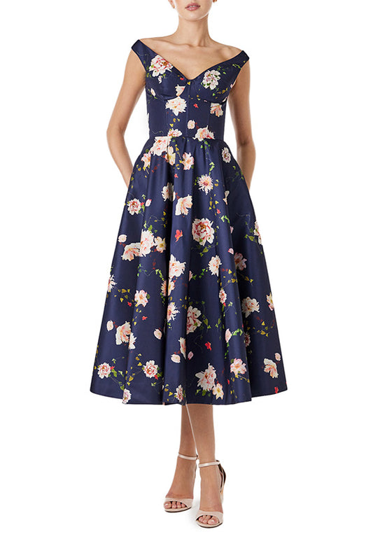 Monique Lhuillier navy floral midi dress with off the shoulder neckline, fit & flare skirt and pockets.