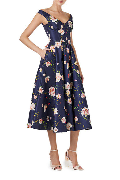 Monique Lhuillier navy floral midi dress with off the shoulder neckline, fit & flare skirt and pockets.