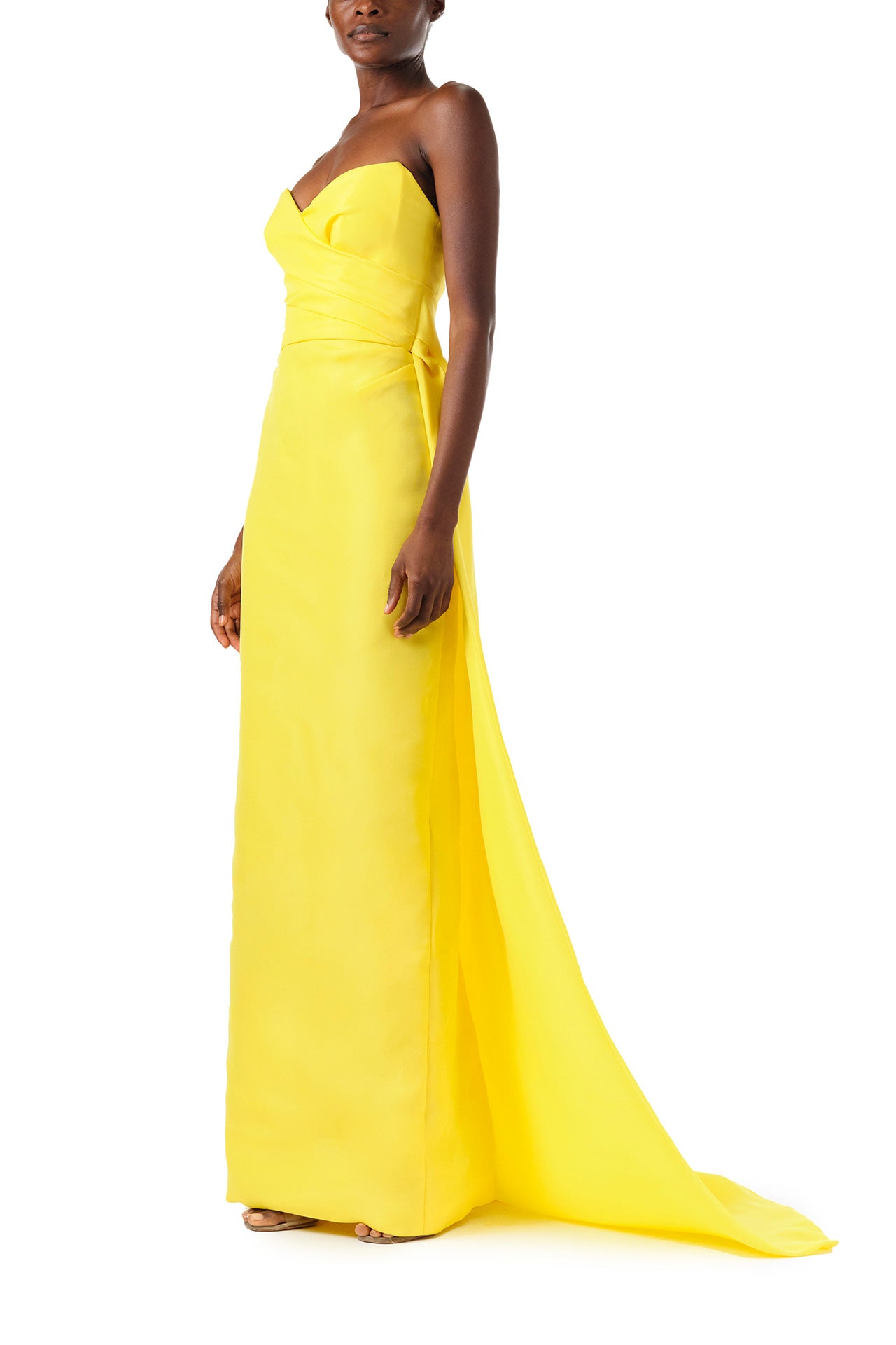 Monique Lhuillier Spring 2024 yellow strapless gown with sweetheart neckline and train - left side.