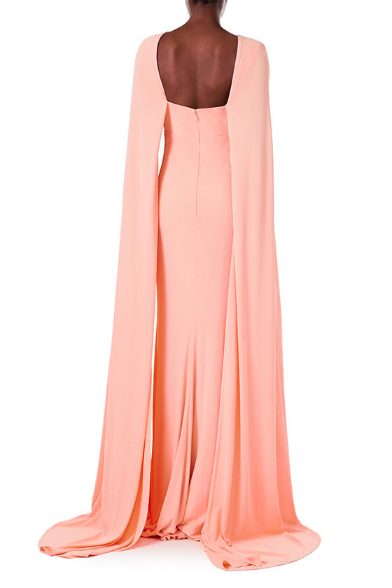 Monique Lhuillier melon colored crepe-back satin gown with attached cape and keyhole bodice.