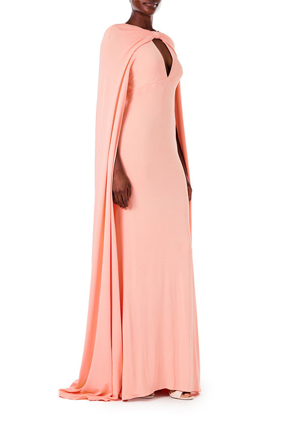 Monique Lhuillier melon colored crepe-back satin gown with attached cape and keyhole bodice.