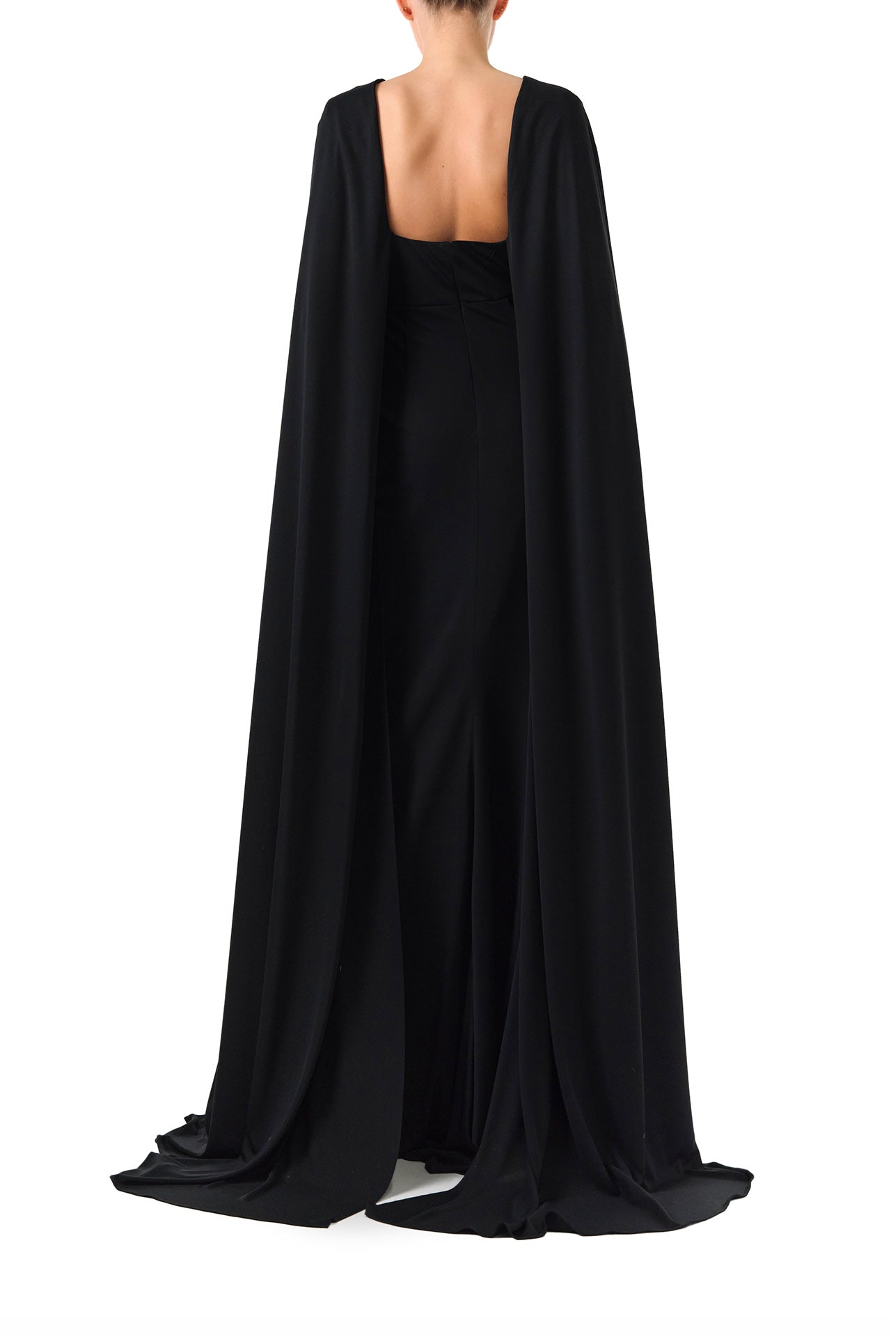 Monique Lhuillier Spring 2024 black crepe-back satin gown with attached cape and keyhole bodice - back.