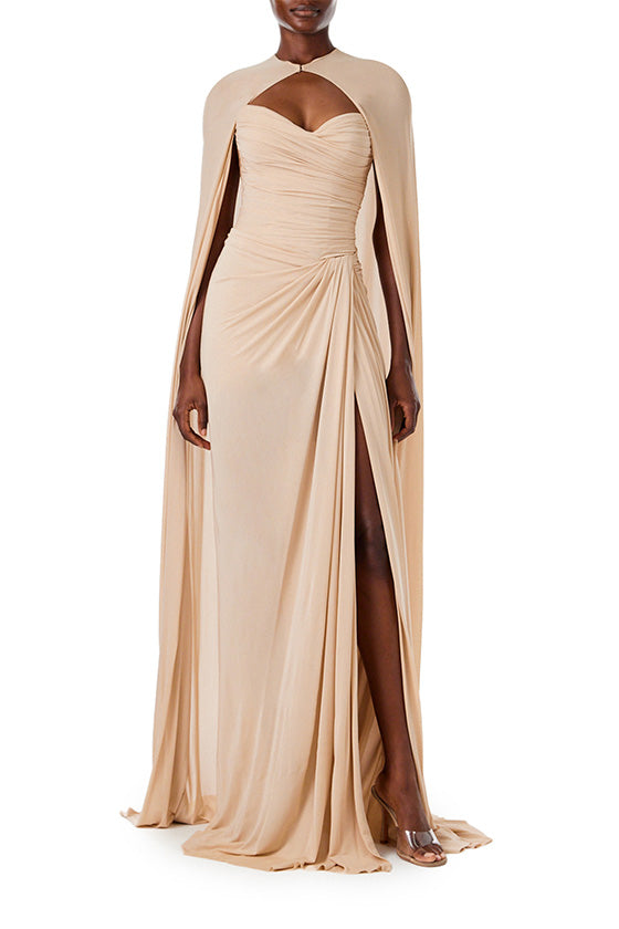 Monique Lhuillier strapless floor length gown with sweetheart neckline and high front leg slit in sand colored matte jersey fabric.