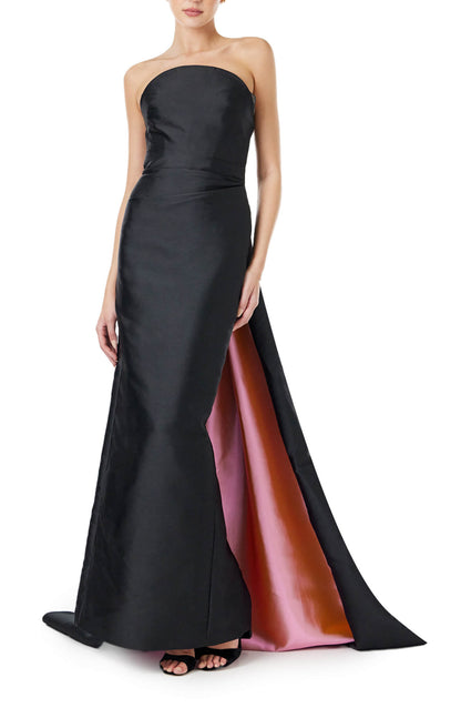 Monique Lhuillier strapless column gown in black silk faille with pink bi-color train.