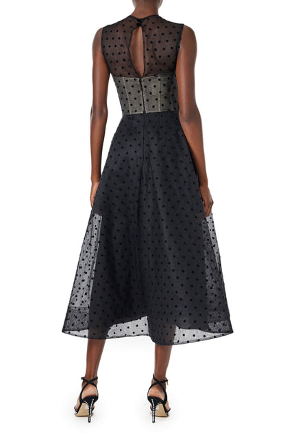 Monique Lhuillier noir dotted tulle, sleeveless jewel neck cocktail dress with caged skirt.