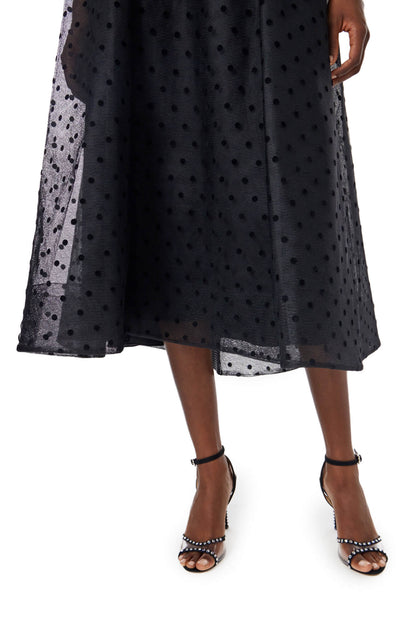 Monique Lhuillier noir dotted tulle, sleeveless jewel neck cocktail dress with caged skirt.