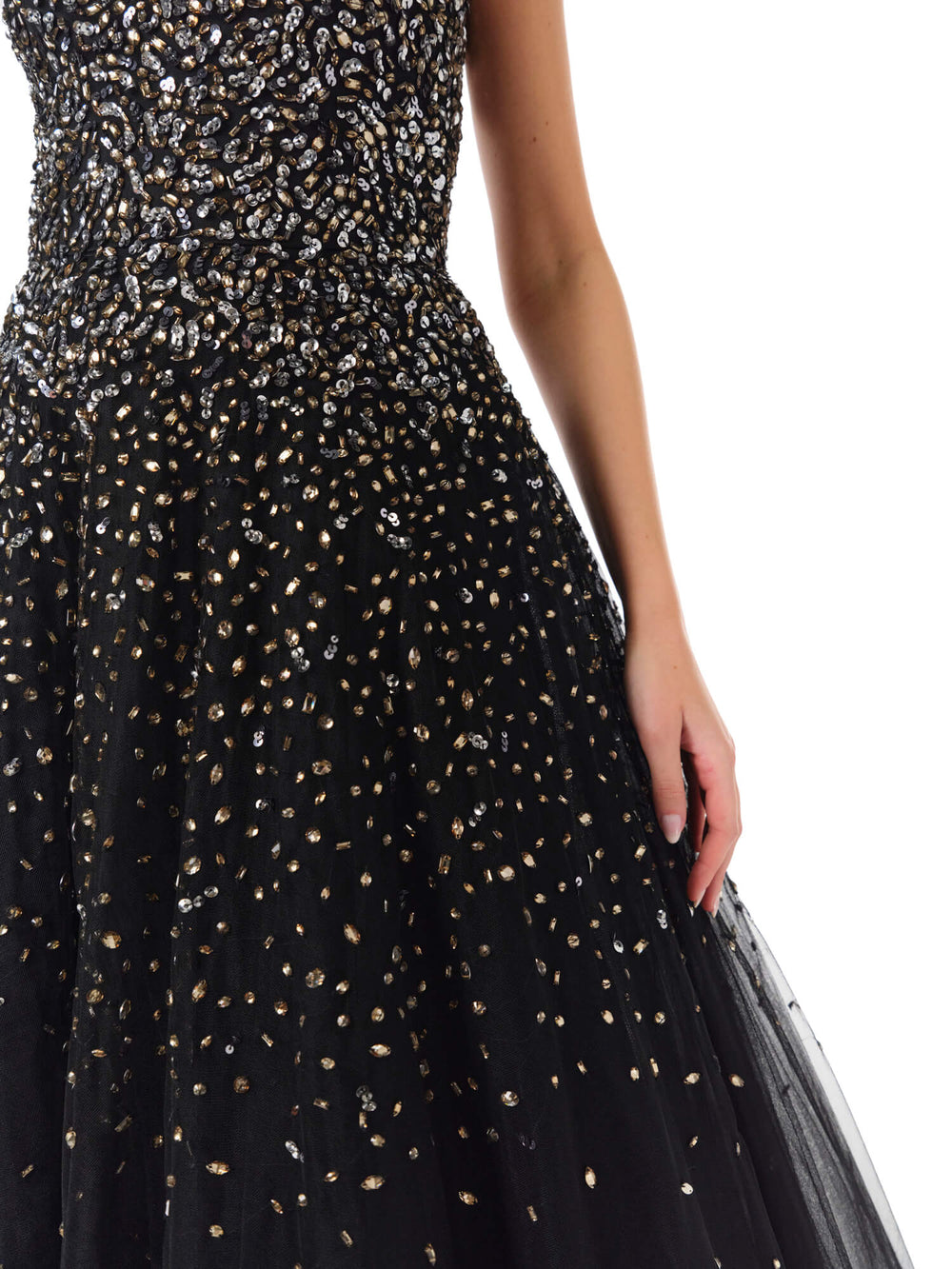 Monique Lhuillier Spring 2024 black tulle gown with metallic embroidery and high-low hem - detail skirt.