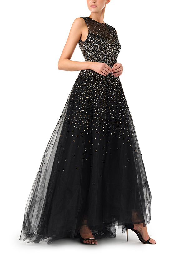Monique Lhuillier Spring 2024 black tulle gown with metallic embroidery and high-low hem - ride side.