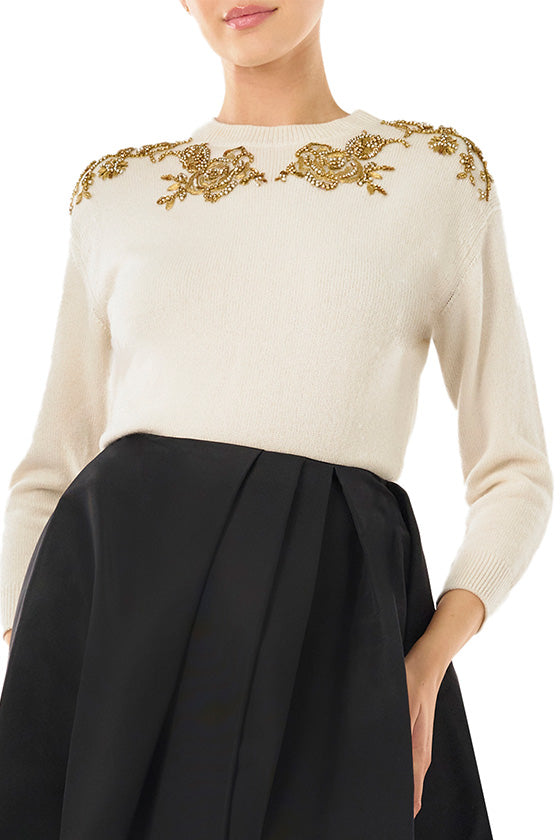 Monique Lhuillier silk white cashmere sweater with gold embroidery.