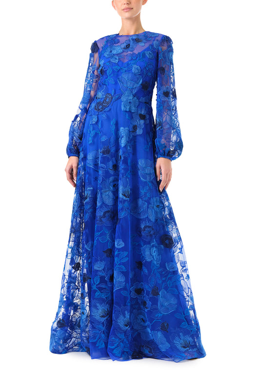Monique Lhuilier Spring 2024 royal blue embroidered tulle long sleeve column gown with jewel neckline and detached slip lining - front.