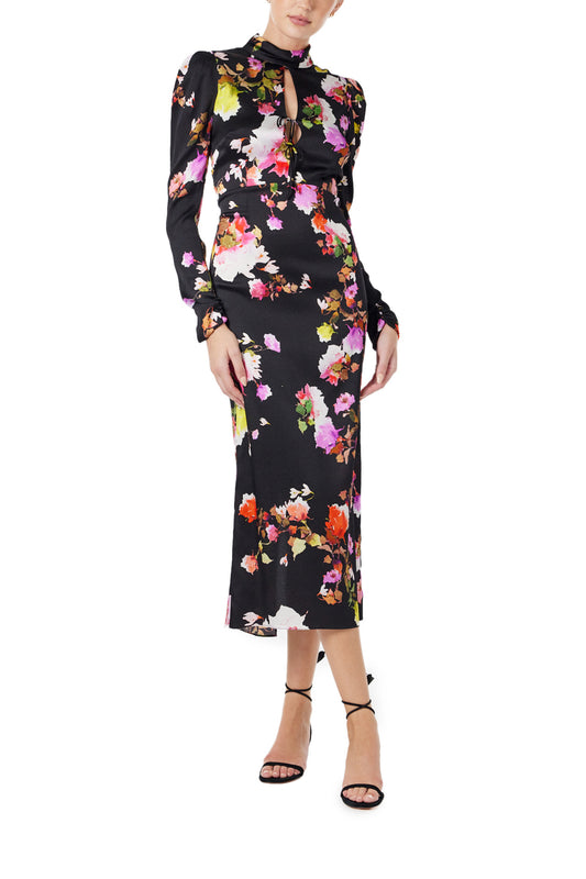Monique Lhuillier Spring 2024 long sleeve midi dress with high neck and tied front keyhole bodice in black floral hammered silk - front.