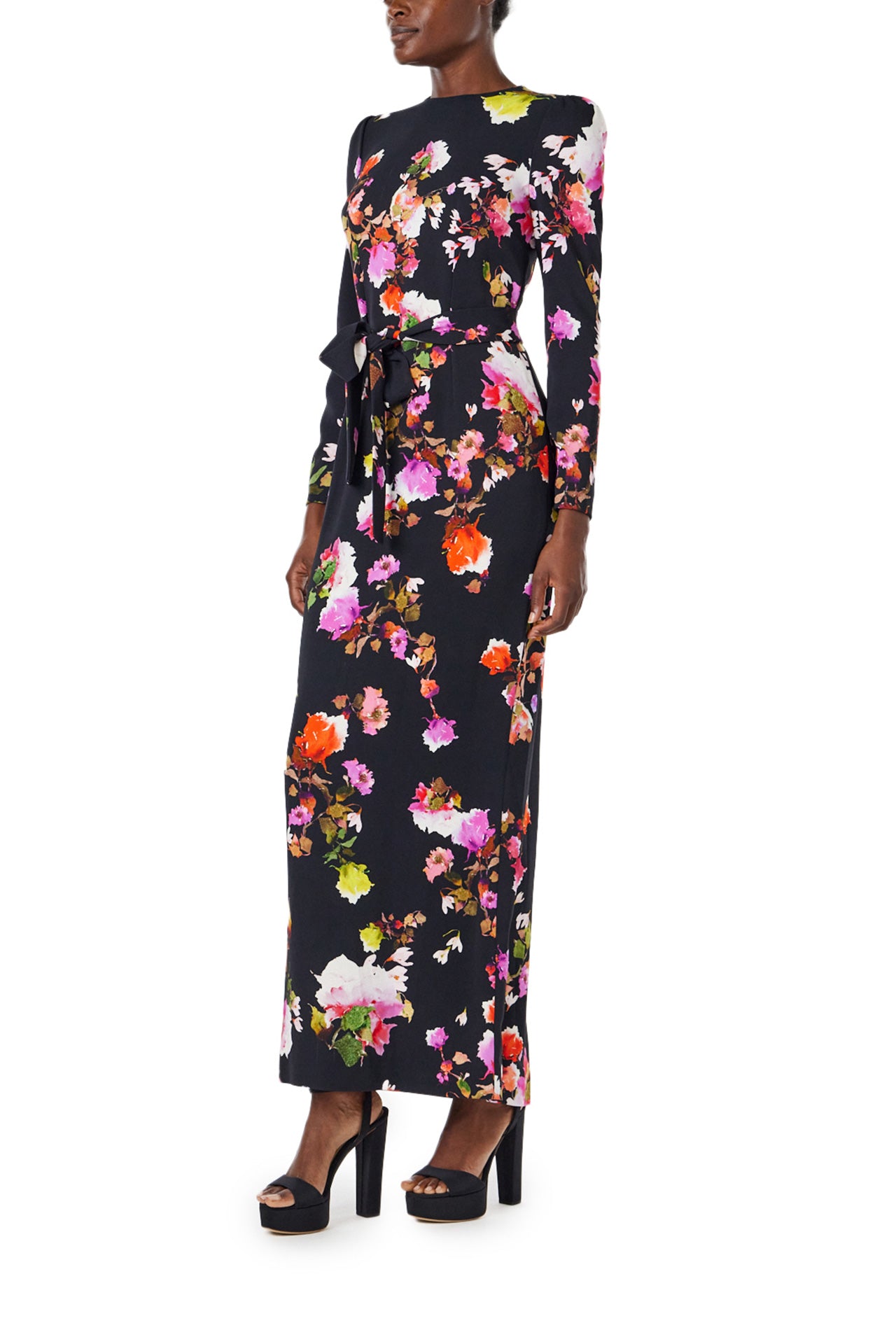 Monique Lhuillier Spring 2024 long sleeve, jewel neck floral print gown with self-tie belt at waist. - left side.