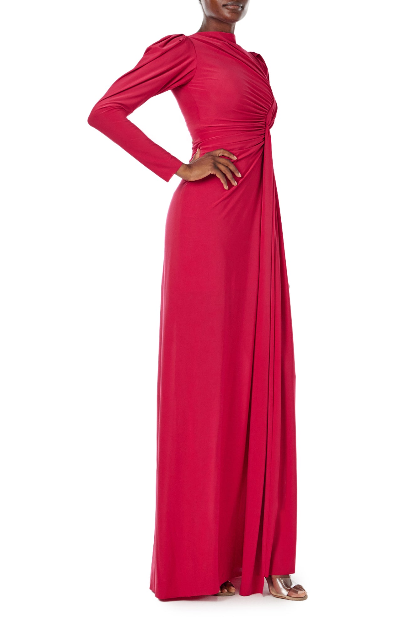 Monique Lhuillier Spring 2024 scarlet red matte jersey long sleeve, gown with draped bodice, jewel neckline and high front skirt slit - right side.