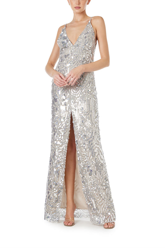 Monique Lhuillier Spring 2024 silver sequin slip gown with deep v neckline and high front slit - front.