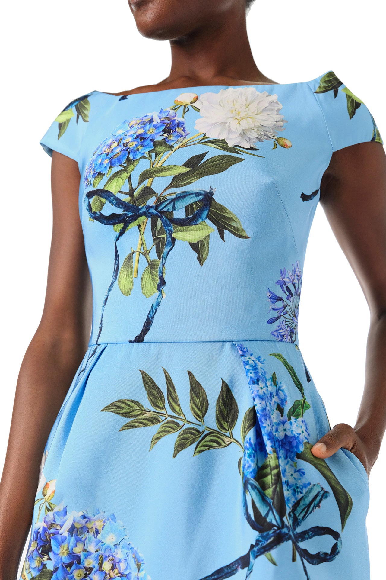 Monique Lhuillier Spring 2024 column gown with bateau neckline, cap sleeves and pockets in Sky Blue Hydrangea printed silk faille - fabric.