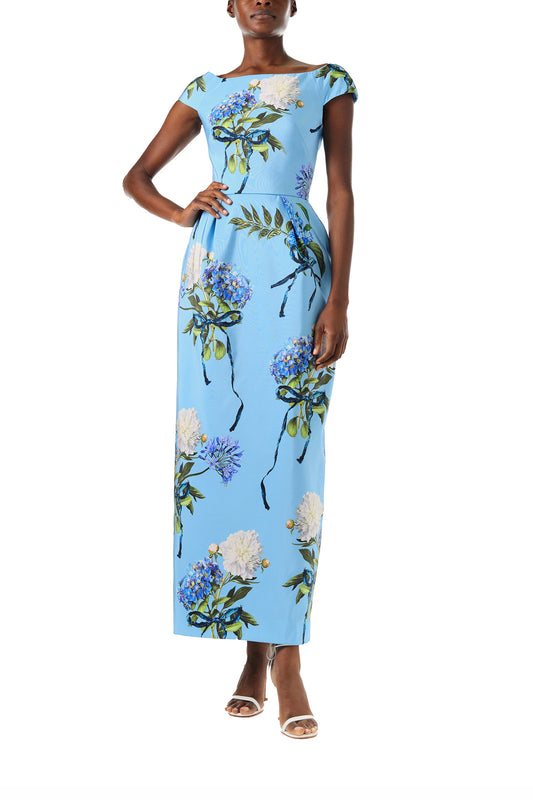 Monique Lhuillier Spring 2024 column gown with bateau neckline, cap sleeves and pockets in Sky Blue Hydrangea printed silk faille - front.
