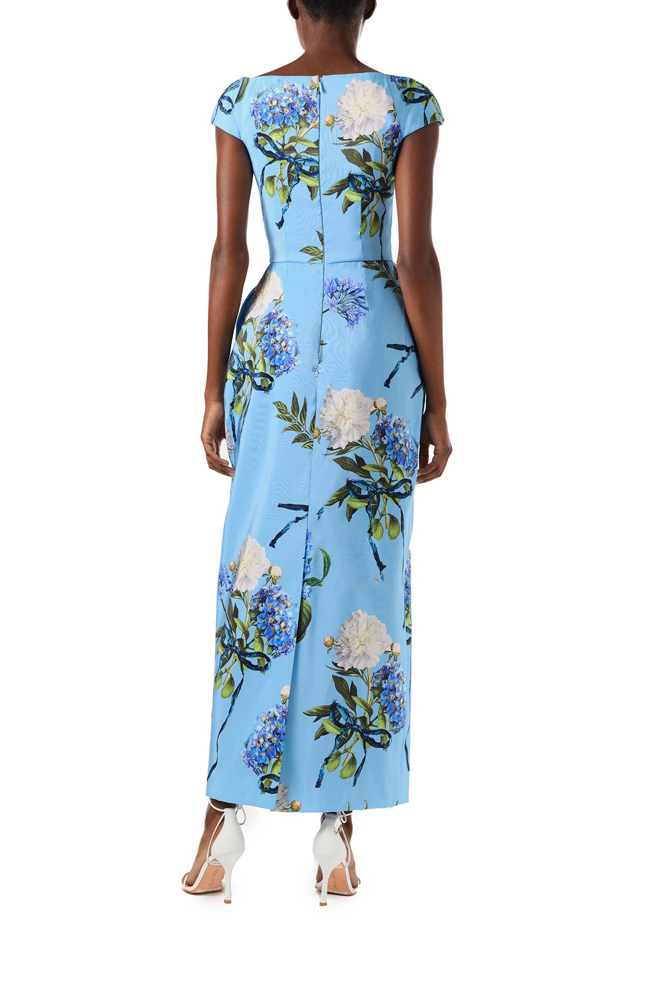 Monique Lhuillier Spring 2024 column gown with bateau neckline, cap sleeves and pockets in Sky Blue Hydrangea printed silk faille - back.