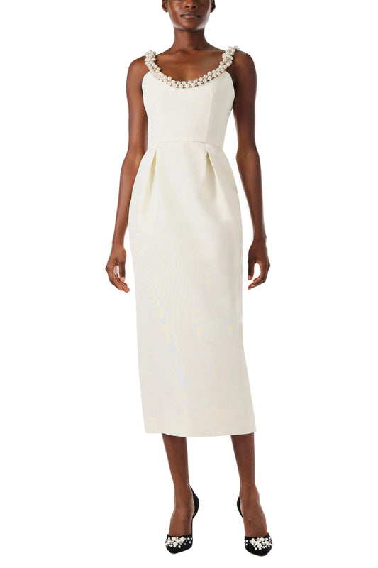 Monique Lhuillier Fall 2024 sleeveless, scoop neck cocktail dress with pearl embroidered neckline, low back, pockets, and natural waist seam - front.