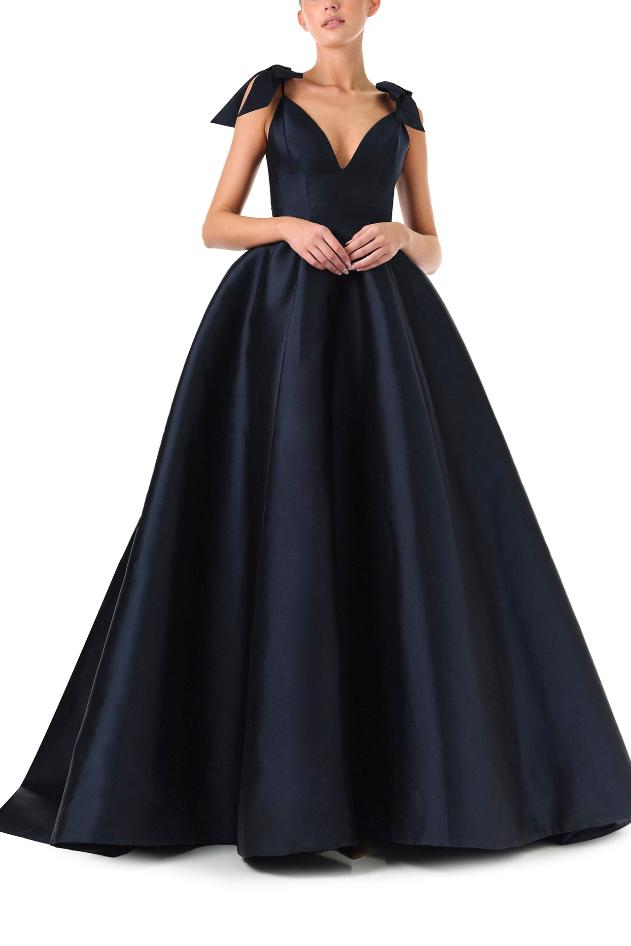 Monique Lhuillier Fall 2024 deep V-neck ball gown in navy mikado with full skirt and bow detail at shoulders - front two.