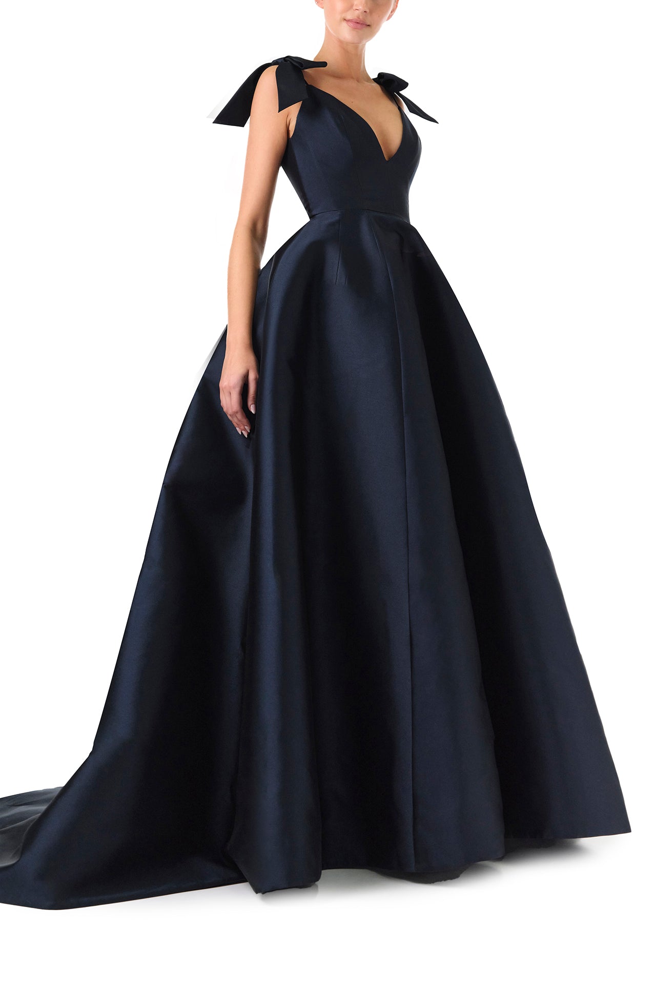 Monique Lhuillier Fall 2024 deep V-neck ball gown in navy mikado with full skirt and bow detail at shoulders - right side,
