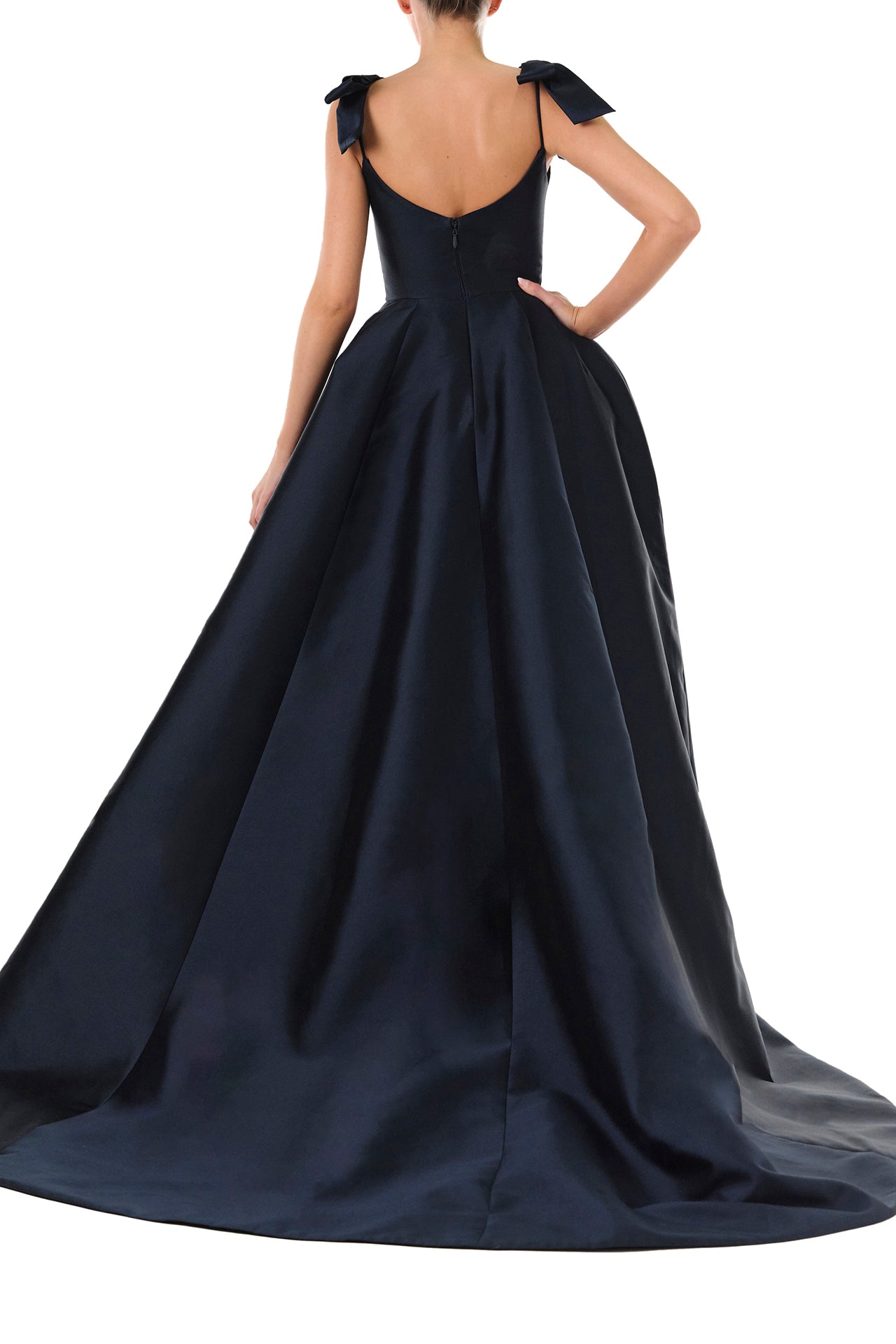 Monique Lhuillier Fall 2024 deep V-neck ball gown in navy mikado with full skirt and bow detail at shoulders - back.