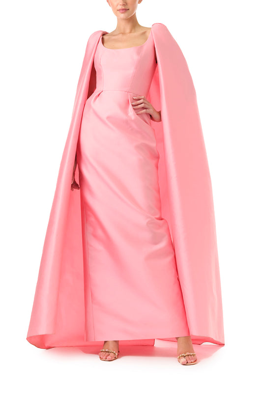 Monique Lhuillier Fall 2024 Dahlia pink mikado, sleeveless column gown with scoop neckline and attached cape - front.