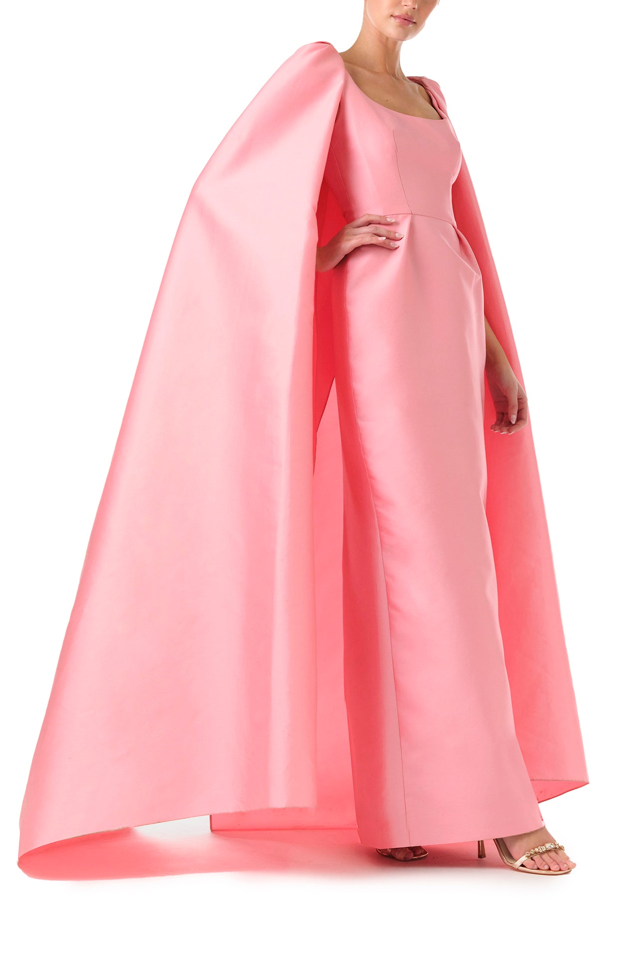 Monique Lhuillier Fall 2024 Dahlia pink mikado, sleeveless column gown with scoop neckline and attached cape - right.
