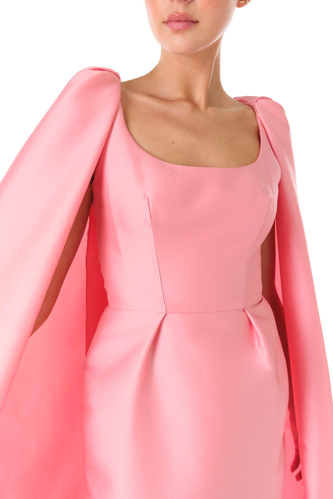 Monique Lhuillier Fall 2024 Dahlia pink mikado, sleeveless column gown with scoop neckline and attached cape - detail two.