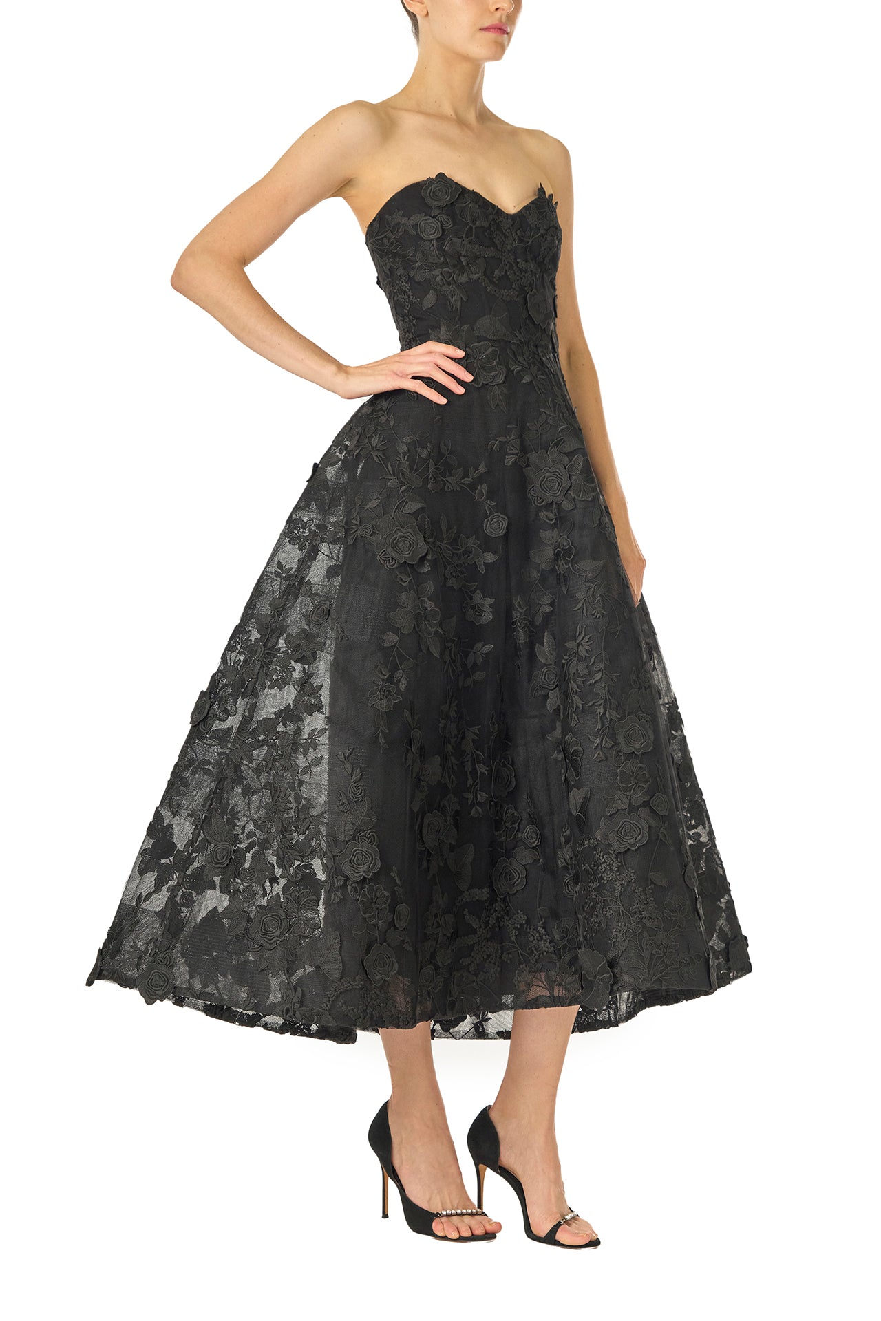 Monique Lhuillier Fall 2024 tea-length, strapless dress in noir 3D lace with full skirt and fitted sweetheart bodice - right side.