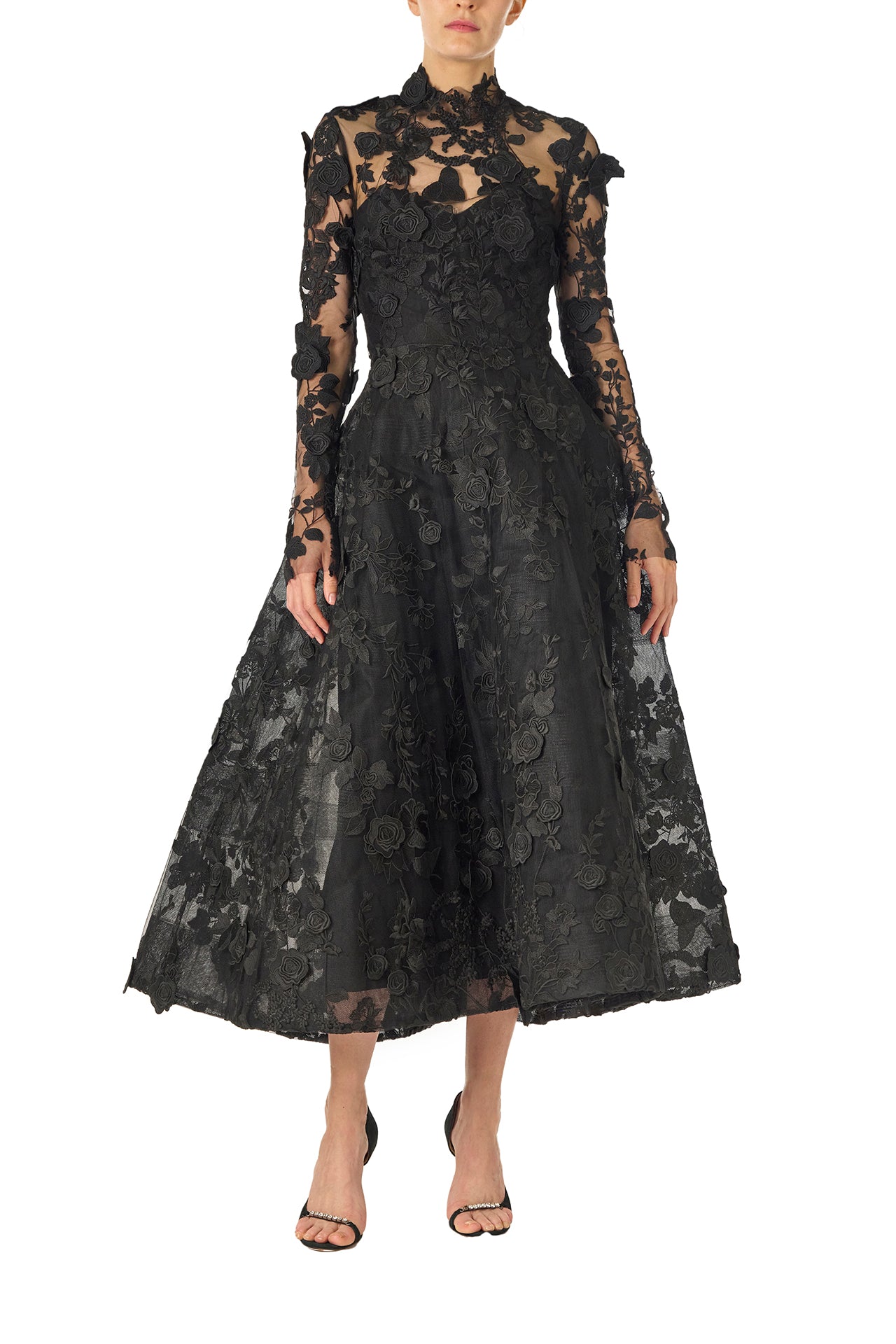Monique Lhuillier Fall 2024 tea-length, strapless dress in noir 3D lace with full skirt and fitted sweetheart bodice with long sleeve lace jacket.