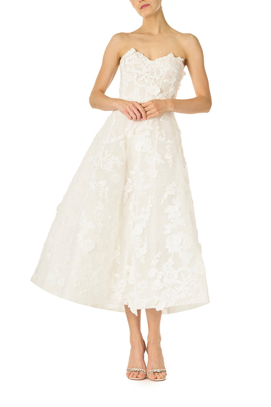Monique Lhuillier Fall 2024 tea-length, strapless dress in silk white3D lace with full skirt and fitted sweetheart bodice - front.