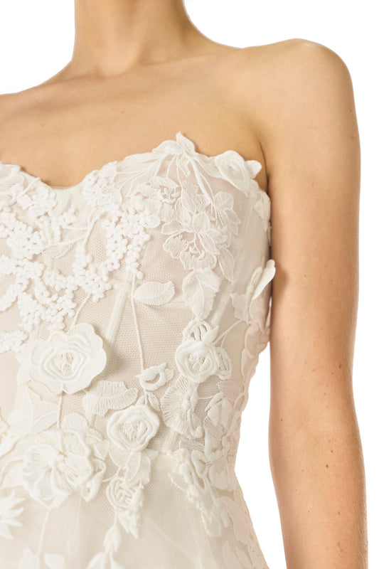 Monique Lhuillier Fall 2024 tea-length, strapless dress in silk white3D lace with full skirt and fitted sweetheart bodice - fabric detail.