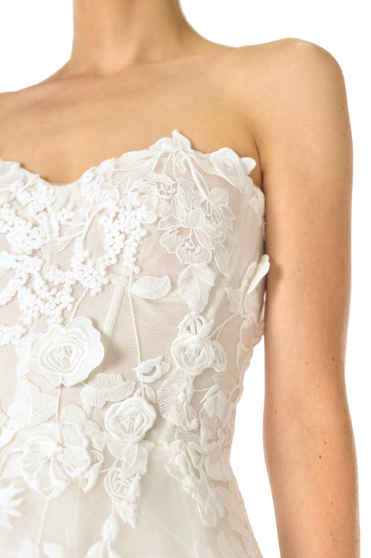 Monique Lhuillier Fall 2024 tea-length, strapless dress in silk white3D lace with full skirt and fitted sweetheart bodice - fabric detail.
