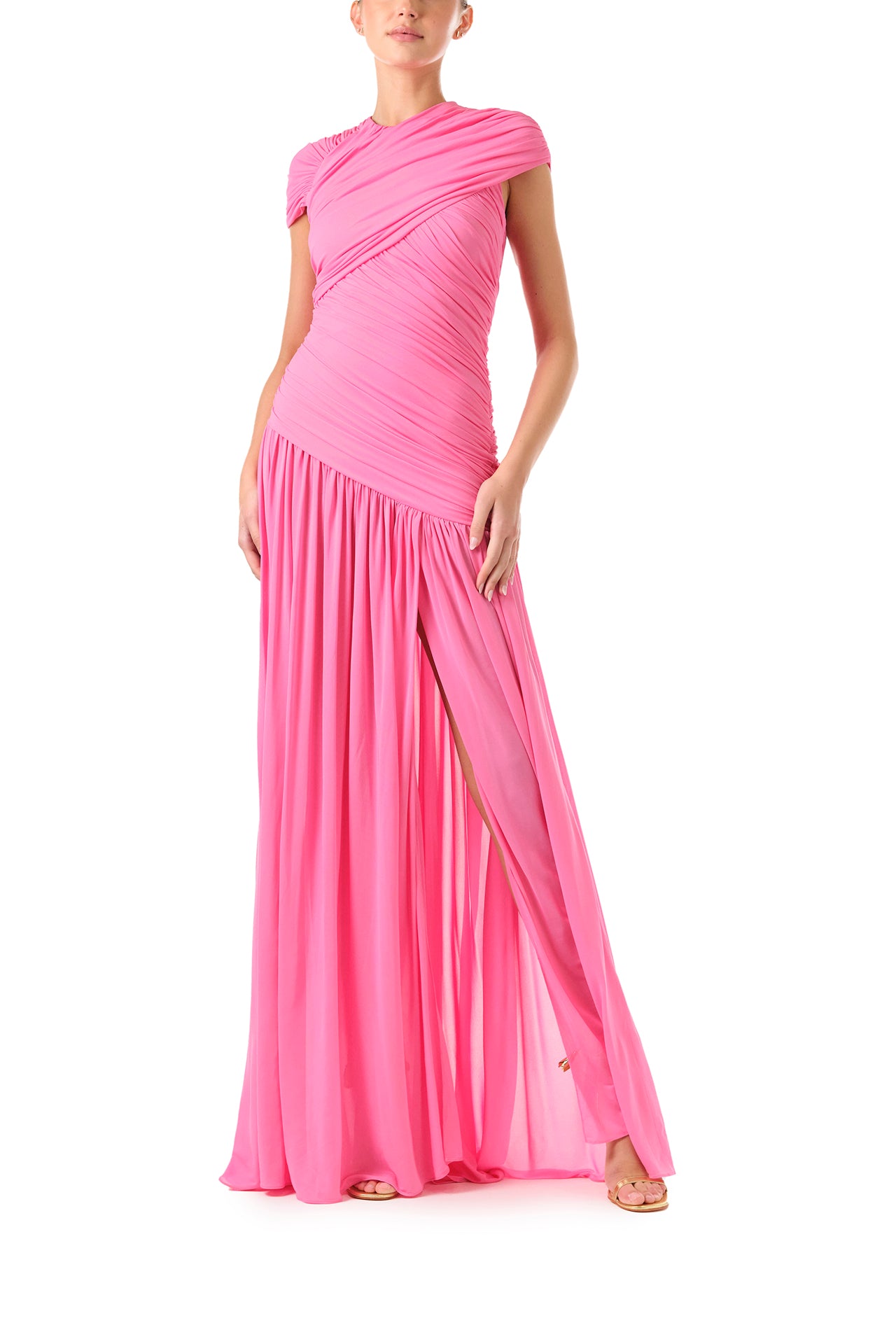 Monique Lhuillier Fall 2024 draped, asymmetric gown with drop waist, cap sleeves and front leg slit in pink crepe jersey fabric - front two.